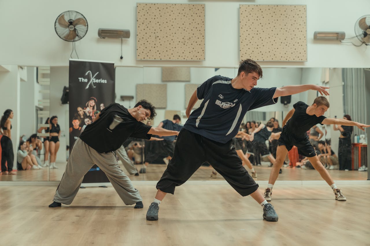 Energetic dance routine at a vibrant indoor workshop, showcasing diverse dancers.